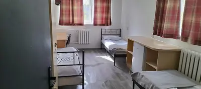 Łóżko lub łóżka w pokoju w obiekcie Hostel Pracowniczy za FSO