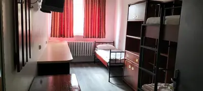 Łóżko lub łóżka w pokoju w obiekcie Hostel Pracowniczy za FSO