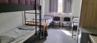 Łóżko lub łóżka w pokoju w obiekcie Hostel Pracowniczy za FSO
