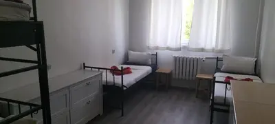 Łóżko lub łóżka w pokoju w obiekcie Hostel Pracowniczy za FSO