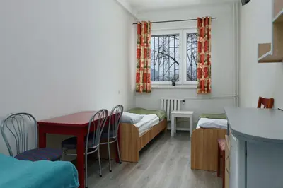 Łóżko lub łóżka w pokoju w obiekcie Hostel Pracowniczy za FSO