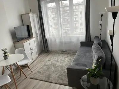 Telewizja i/lub zestaw kina domowego w obiekcie Mokotów Residence Szpilman`s Apartament