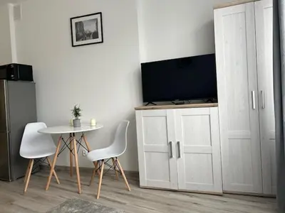 Telewizja i/lub zestaw kina domowego w obiekcie Mokotów Residence Szpilman`s Apartament