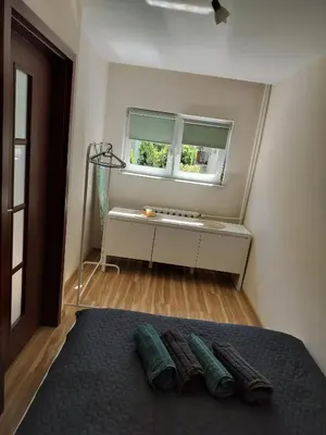Łóżko lub łóżka w pokoju w obiekcie Cosy Apartment Zwycięzców Saska Kępa