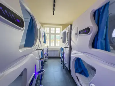 Łóżko lub łóżka w pokoju w obiekcie Boutique-Capsule Hostel
