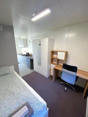Łóżko lub łóżka w pokoju w obiekcie Student House Pawilony