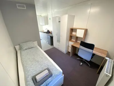 Łóżko lub łóżka w pokoju w obiekcie Student House Pawilony