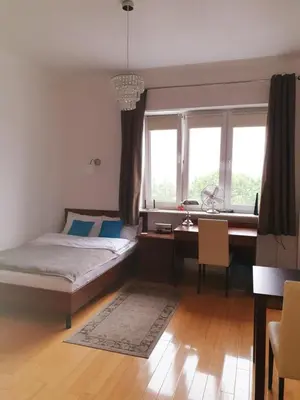 Łóżko lub łóżka w pokoju w obiekcie Studio Latte Juliana Bartoszewicza