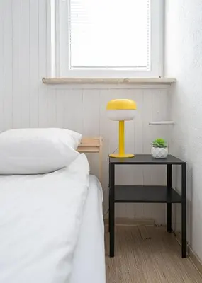 Łóżko lub łóżka w pokoju w obiekcie RentPlanet - Apartament przy Parku Mirowskim