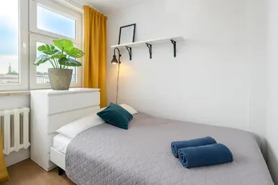 Łóżko lub łóżka w pokoju w obiekcie Cozy Apartment in City Center