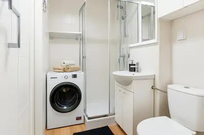 Łazienka w obiekcie Cozy Apartment in City Center