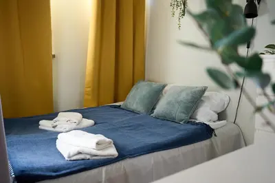 Łóżko lub łóżka w pokoju w obiekcie Cozy Apartment in City Center