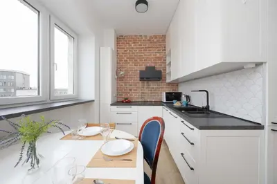 Kuchnia lub aneks kuchenny w obiekcie Warsaw Central Apartment by Noclegi Renters