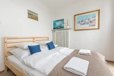 Łóżko lub łóżka w pokoju w obiekcie P&O Apartments Grzybowska II