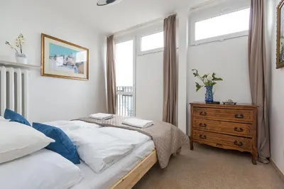 Łóżko lub łóżka w pokoju w obiekcie P&O Apartments Grzybowska II