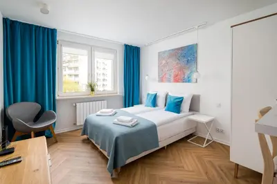 Łóżko lub łóżka w pokoju w obiekcie Solec Blue Harmony Studio by BookingHost
