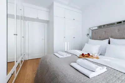 Łóżko lub łóżka w pokoju w obiekcie P&O Apartments Airport