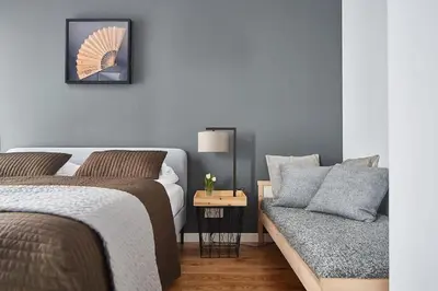 Łóżko lub łóżka w pokoju w obiekcie Elegant Apartment Żoliborz Arkadia by Renters Prestige