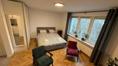 Łóżko lub łóżka w pokoju w obiekcie Słoneczne i przytulne mieszkanie na Muranowie