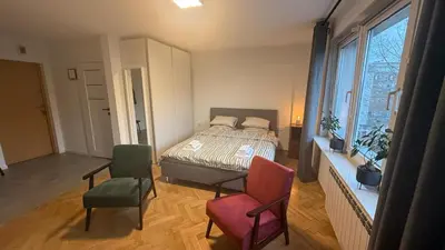 Łóżko lub łóżka w pokoju w obiekcie Słoneczne i przytulne mieszkanie na Muranowie