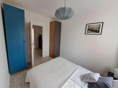 Łóżko lub łóżka w pokoju w obiekcie Bonifacy Apartment