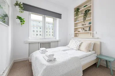 Łóżko lub łóżka w pokoju w obiekcie RentPlanet - Apartament Aleje Jerozolimskie
