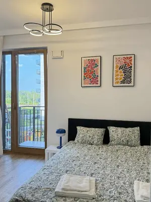 Łóżko lub łóżka w pokoju w obiekcie Mei Apartment near Chopin Airport Warsaw