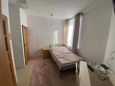 Łóżko lub łóżka w pokoju w obiekcie Arkuszowa 58 Apartament 5