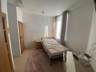 Łóżko lub łóżka w pokoju w obiekcie Arkuszowa 58 Apartament 5