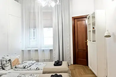 Łóżko lub łóżka w pokoju w obiekcie D&A Apartament Powiśle Solec PGE Narodowy