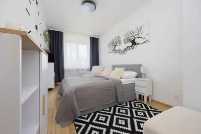 Łóżko lub łóżka w pokoju w obiekcie Śmiała Comfy Apartment Pet-friendly by Noclegi Renters