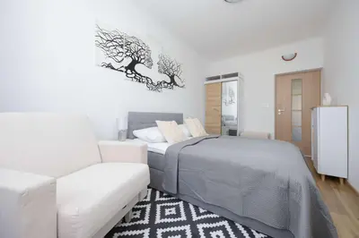 Łóżko lub łóżka w pokoju w obiekcie Śmiała Comfy Apartment Pet-friendly by Noclegi Renters