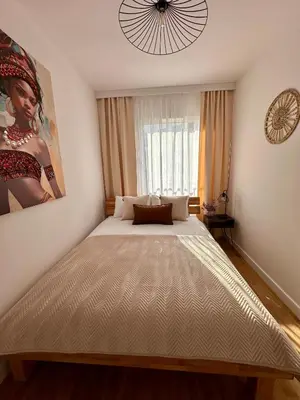 Łóżko lub łóżka w pokoju w obiekcie Millennium Talarowa Mango