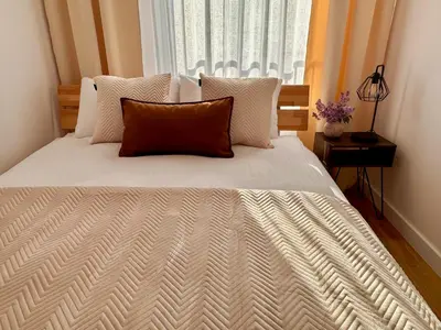 Łóżko lub łóżka w pokoju w obiekcie Millennium Talarowa Mango