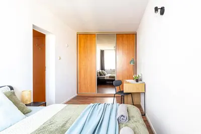 Łóżko lub łóżka w pokoju w obiekcie Igańska Apt 65 SuperApart - Blisko Stadionu Narodowego