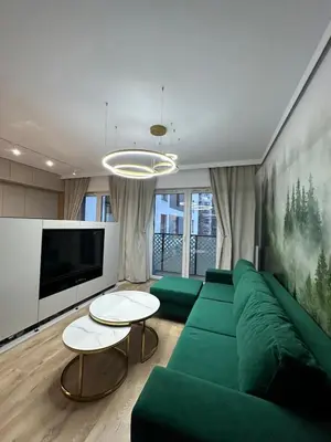 Telewizja i/lub zestaw kina domowego w obiekcie Golden Forest Apartment