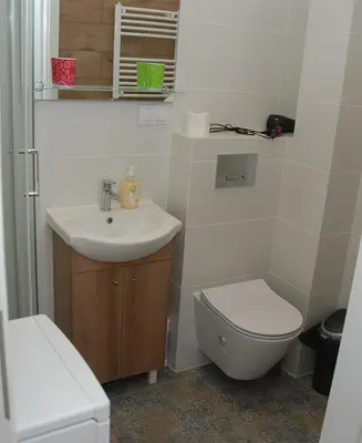 Łazienka w obiekcie Cozy Apartment Penthouse Praga Kamionek