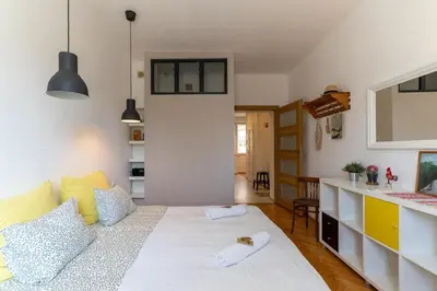 Łóżko lub łóżka w pokoju w obiekcie Warsaw Concierge Paryska