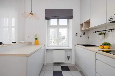 Kuchnia lub aneks kuchenny w obiekcie Targowa Bright Studio Close to PGE by Noclegi Renters