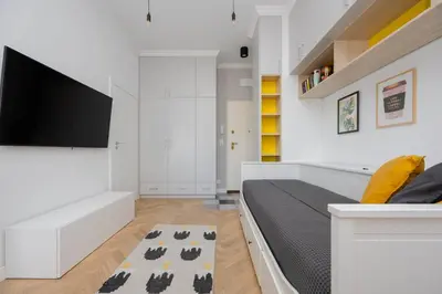 Telewizja i/lub zestaw kina domowego w obiekcie Targowa Bright Studio Close to PGE by Noclegi Renters
