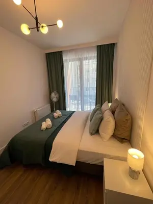 Łóżko lub łóżka w pokoju w obiekcie Dzielna Prime Apartment