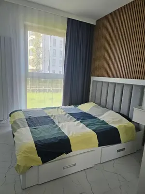 Łóżko lub łóżka w pokoju w obiekcie Apartment Chopin Airport Stay Włochy