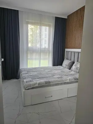 Łóżko lub łóżka w pokoju w obiekcie Apartment Chopin Airport Stay Włochy