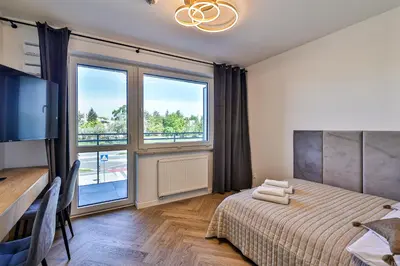 Łóżko lub łóżka w pokoju w obiekcie PIleckiego 59 Studio z Balkonem Bezpłatny Parking By Perfect Apart