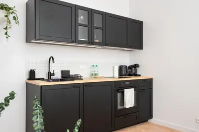 Kuchnia lub aneks kuchenny w obiekcie Plac Zbawiciela City Glow Apartment by BookingHost