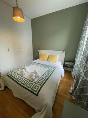 Łóżko lub łóżka w pokoju w obiekcie Cybernetyki Prime Apartment