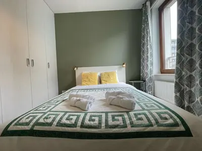 Łóżko lub łóżka w pokoju w obiekcie Cybernetyki Prime Apartment