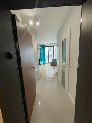 Łóżko lub łóżka w pokoju w obiekcie Cybernetyki Prime Apartment