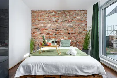 Łóżko lub łóżka w pokoju w obiekcie Lumina 3-room apart with large terrace