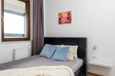 Łóżko lub łóżka w pokoju w obiekcie Business Suite Grzybowska by VAYA STAYS